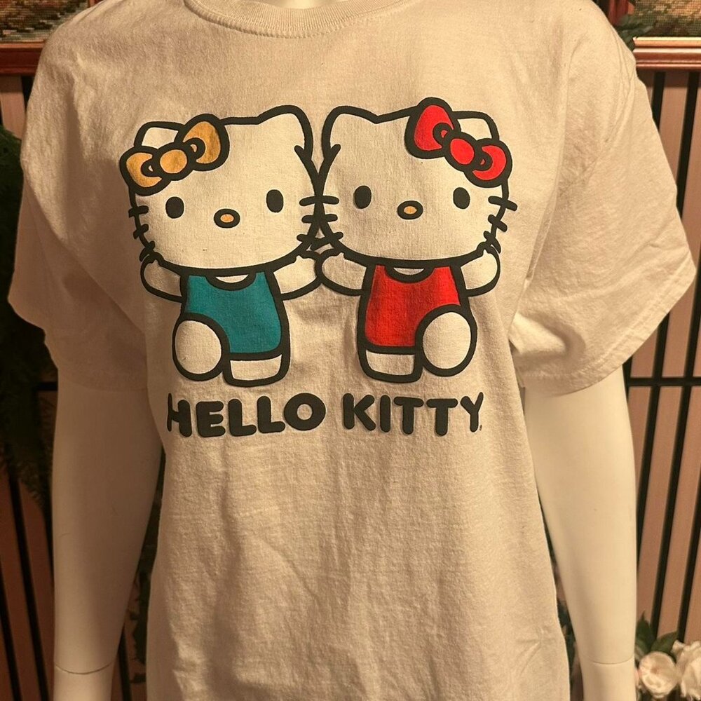 White Hello Kitty graphic tee with blue and red kitty
